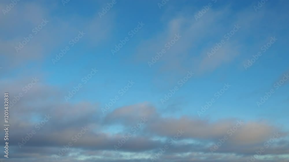 Poster observe dynamic flow of clouds against a vibrant blue sky, real time capture. experience gradual shi