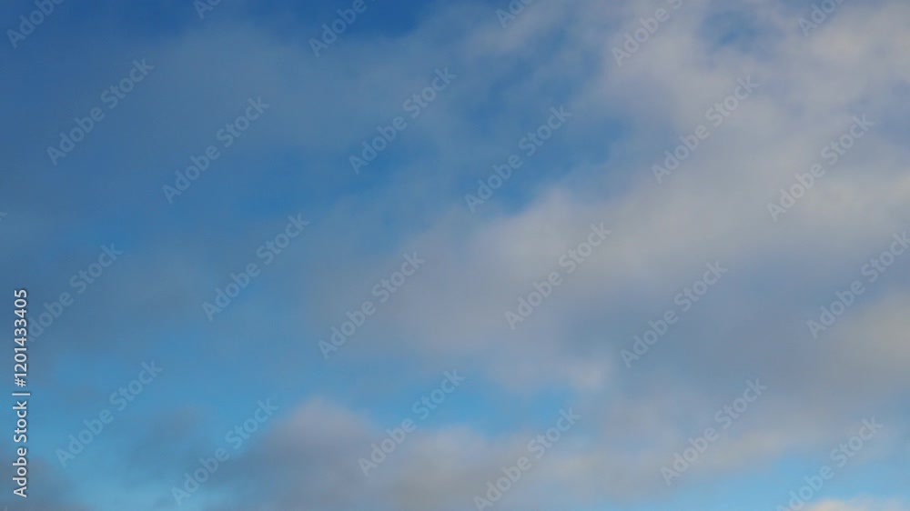 Poster observe dynamic flow of clouds against a vibrant blue sky, real time capture. experience gradual shi
