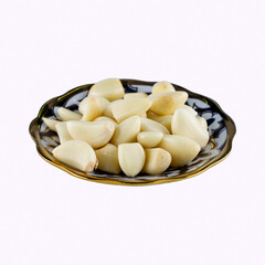 garlic peeled on a plate on a white background, fresh organic, studio shot