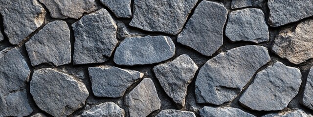 Fototapeta premium Close-up of a rustic stone wall texture.