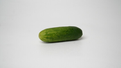 A fresh cucumber isolated on a white background.
