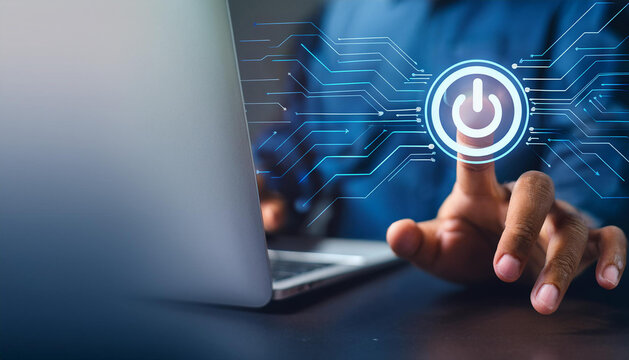 Man using laptop with pressing power button on virtual screen. Start or shut down concept. news on