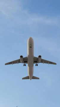 Commercial airplane flying in the sky, ideal for travel, aviation, transportation, airline, and air travel concepts. Travel, tourism. 