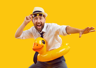 Happy excited office worker having fun on summer holiday. Studio portrait funny business man in...