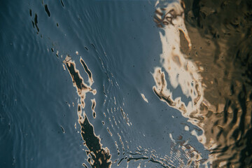 The water is calm and still, with ripples forming on the surface