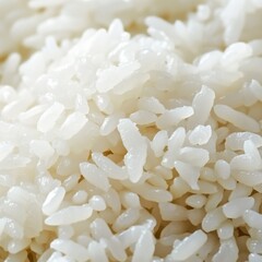 Close-up of sushi rice. Focused view of perfectly cooked sushi rice. Emphasizing texture and stickiness. Ideal for sushi recipes and Japanese cuisine blogs.