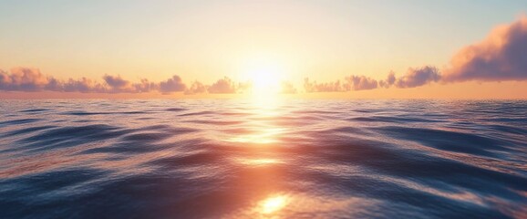 Obraz premium A serene ocean scene at sunset, with the sun setting behind a cloud in front of an endless horizon.