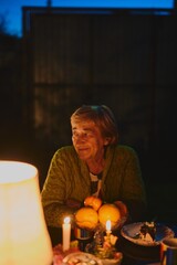 Old Caucasian grandmother celebrates anniversary with family