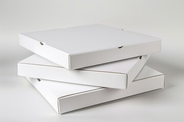 Three plain white pizza boxes are stacked, creating a pyramid shape against a minimalist white backdrop