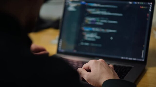 Exploring coding practices during a late-night programming session in a modern workspace