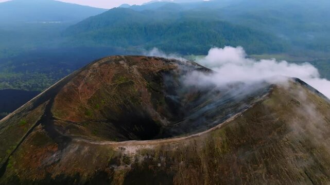 A breathtaking cinematic aerial panoramic view of Paricutin Volcano in Michoacan, Mexico, surrounded by ethereal clouds. A majestic display of nature's raw power and serene beauty.