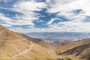 view of leh city surrounded by beautiful himalayan mountains, passing through the khardung la road in the ladakh district, India.