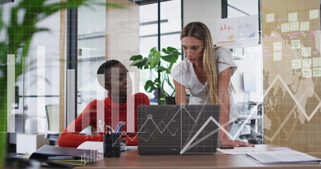 Image of data processing and diagrams over diverse female colleagues discussing work in office