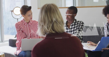 Image of data processing and diagrams over diverse colleagues discussing work in office