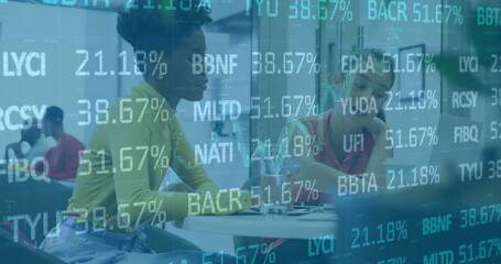 Image of financial data processing over diverse business people in office