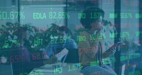 Image of financial data processing over diverse business people in office