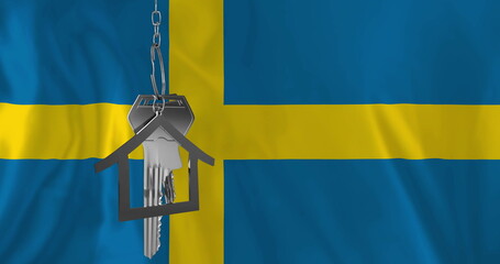 Image of silver house key over flag of sweden
