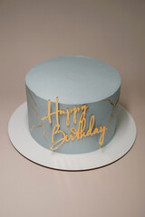 birthday cake on a light background. Festive dessert with caption top view
