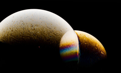 Space abstraction: bright color overflows in the style of soap bubbles. The play of light and textures creates the effect of a planet in the universe. Ideal for concepts of art and futurism.