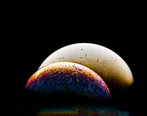 Space abstraction: bright color overflows in the style of soap bubbles. The play of light and textures creates the effect of a planet in the universe. Ideal for concepts of art and futurism.