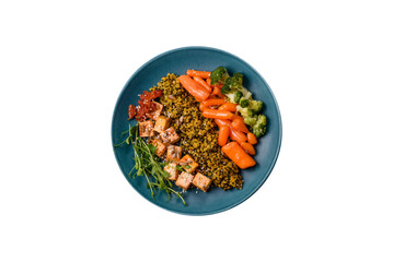 Quinoa bowl with tofu, steamed vegetables, grains, seeds and spices