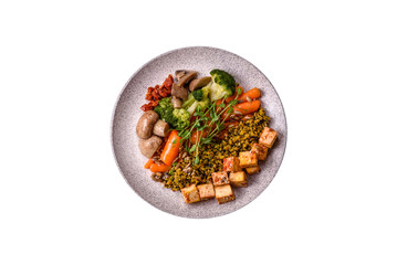 Quinoa bowl with tofu, steamed vegetables, grains, seeds and spices