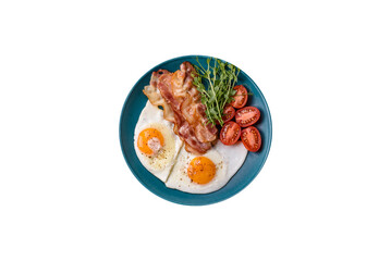 A hearty breakfast with fried eggs, bacon, tomatoes, microgreens