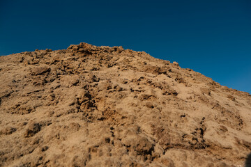 Soil texture background. Brown ground surface. Close up natural background