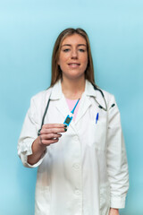 vertical Doctor showing digital thermometer on blue background