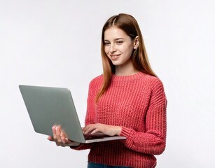 Fototapeta premium Indoor photo of positive teenage girl standing with laptop, smiling at great content from social networks, pressing fingers to touchpad in order to browse web pages, isolated on white background