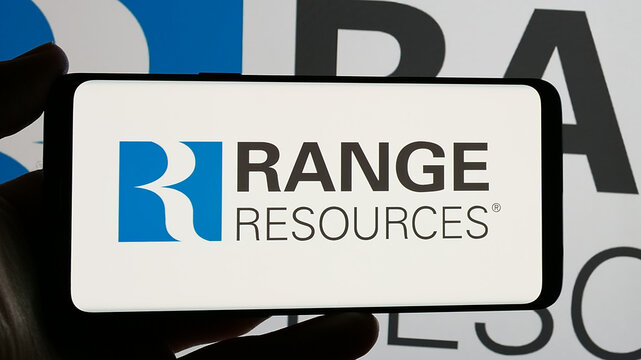 Stuttgart, Germany - 12-20-2024: Person holding smartphone with logo of US natural gas company Range Resources Corporation on screen. Focus on phone display.