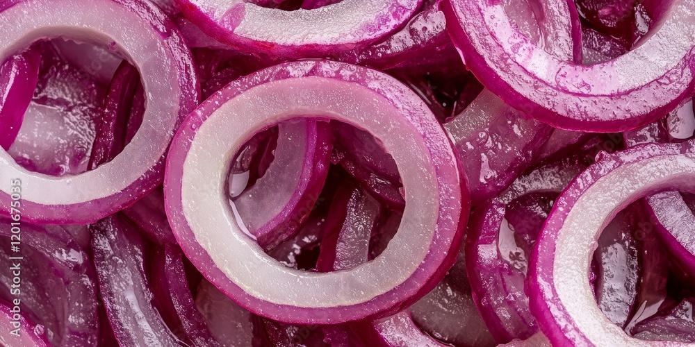 Poster Sliced red onion rings showcase the vibrant color and texture of fresh onions. These sliced red onion rings are perfect for adding a flavorful, zesty touch to various dishes and salads.