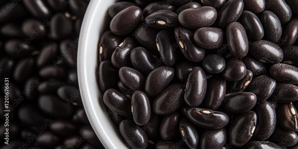 Poster a close up view of black kidney beans arranged neatly in a white bowl, highlighting the contrast and