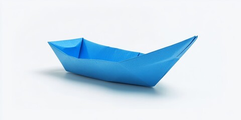 Isolated blue paper boat on a white background, featuring a clear clipping path, perfect for showcasing creativity and simplicity in design. Explore the charm of the blue paper boat.