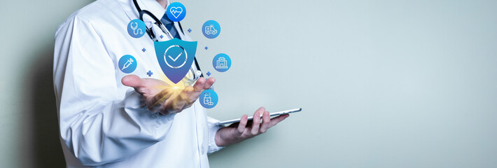 Doctor holding life insurance icons. Concept of health, wellness, life insurance and health for the...