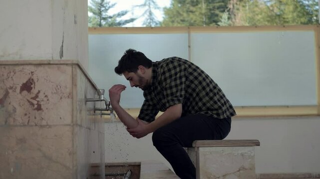  Teenager Washing his Arms 