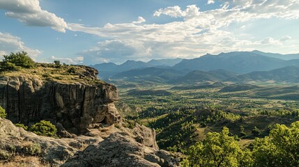 Naklejka premium Mountain valley landscape, scenic view from rocky outcrop, summer day