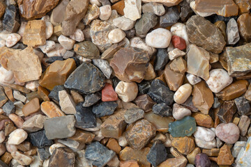 Natural colorful pebbles. Abstract stone background, texture. Stone beach.
