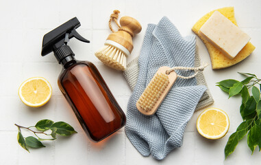 Eco friendly cleaning products promoting sustainable lifestyle on white tile background