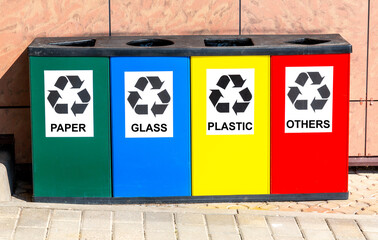 Multicolored containers for separate collection of waste. Separate garbage containers according to...