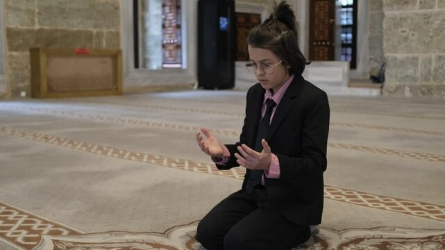 Child praying in mosque