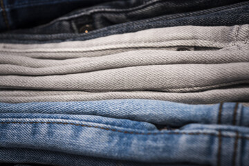 Naklejka premium Jeans fabric. Jeans texture or denim background. Denim sales. Jeans fabric texture. Jean trousers pants. Blue denim cloth. Denim texture for background design. Jeans texture.