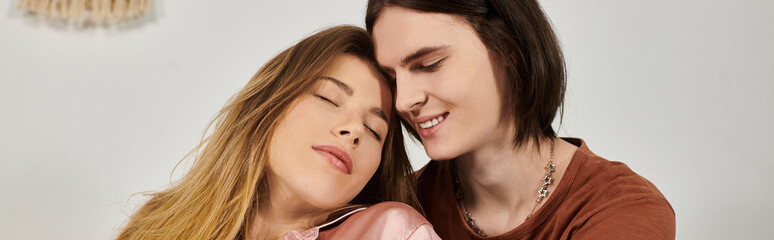 Two young people relax closely together, enjoying a warm and intimate atmosphere of connection.