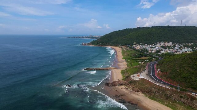 Aerial drone shot of Vizag city by the ocean, highlighting the city&rsquo;s coastal beauty and vibrant waterfront.