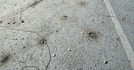 Bare gray concrete ground with scattered debris, bare ground, urban decay, simplicity