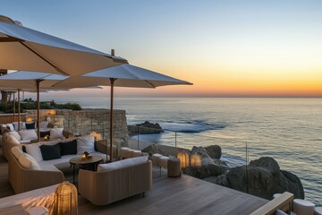 Hotel terrace overlooking the ocean, soft waves, and cozy ambiance