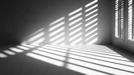 Obraz premium Shadow overlays create striking patterns on the white surface in a well-lit room during the daytime as sunlight filters through the closed shutters
