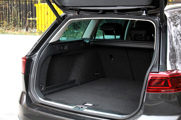 Huge empty trunk of a wagon car.  Open back door modern car. Car boot is open. Wagon clean trunk....