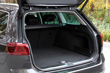 Huge empty trunk of a wagon car.  Open back door modern car. Car boot is open. Wagon clean trunk. Modern wagon car open trunk. Right view.