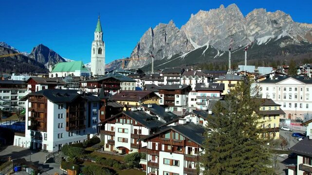 Cinematic Aerial drone footage of Cortina d'Ampezzo at Winter &mdash; Main Venue of 2026 Winter Olympic Games in Dolomites Alps, Italy panoramic view
